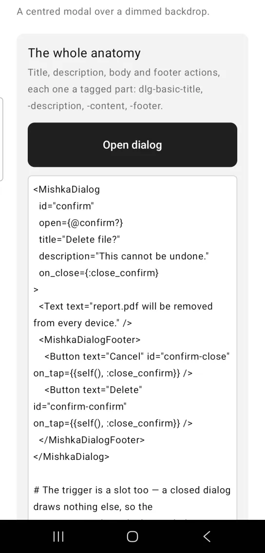 Dialog example card titled The whole anatomy, with a dark Open dialog button, the dialog closed, and the example code below, in the MishkaMob showcase app on Android