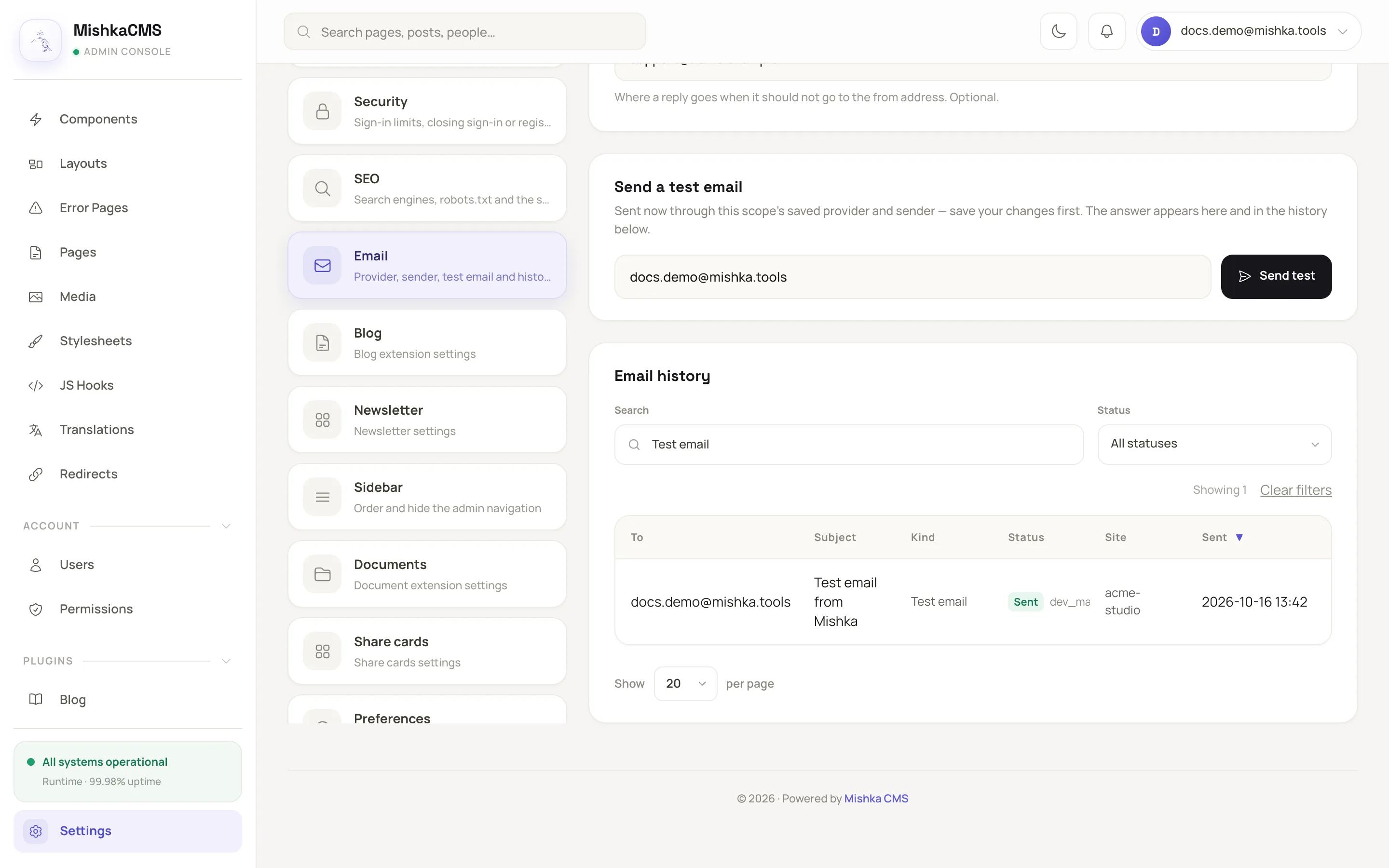 the Send a test email panel with an address filled in, and the Email history table below it with one Test email row marked Sent