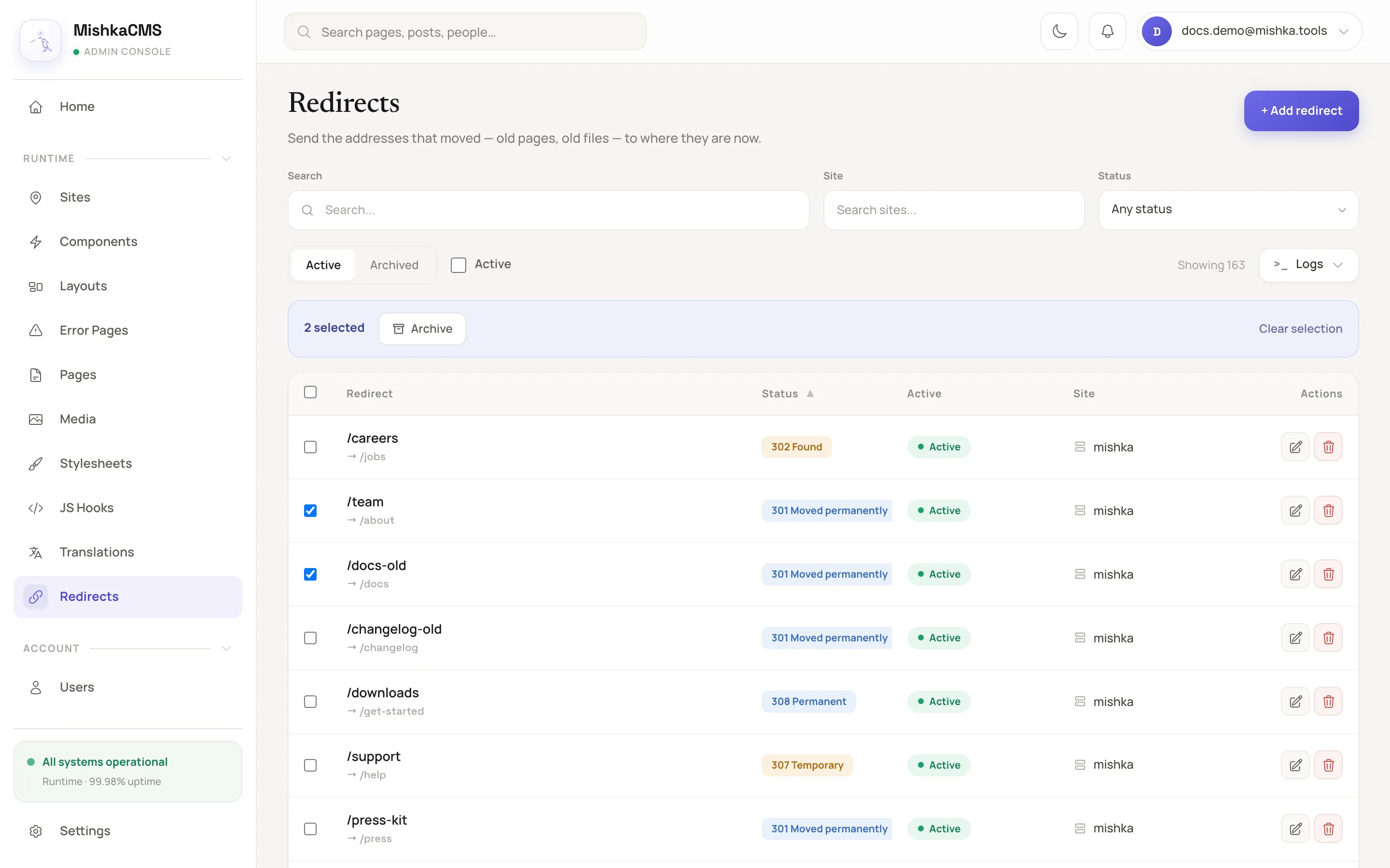 the redirects table with two rows selected, the bulk action bar above the table with the Archive action, and the checkboxes on each row